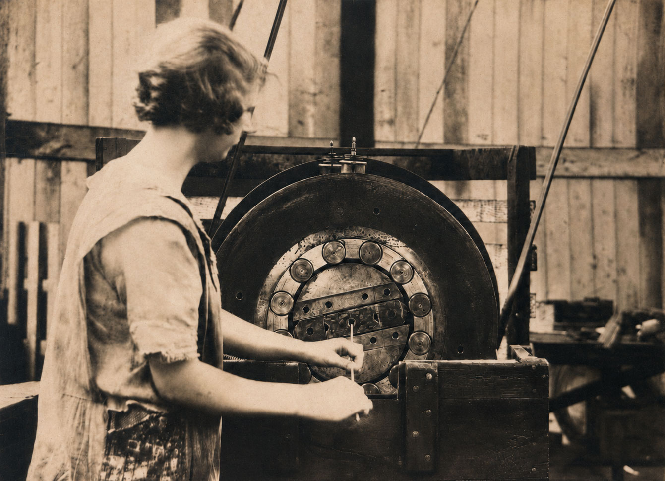 Historic Bruntons worker operating swaging machinery